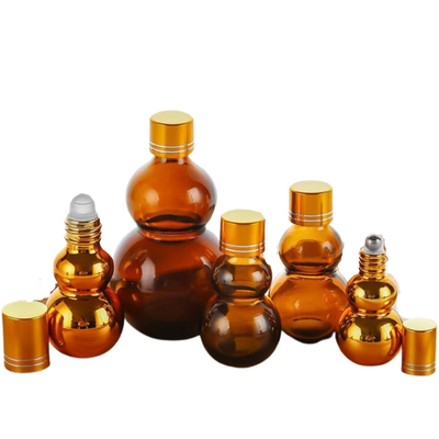 オーダーメイドプレミアム 10ml/50ml/100ml アンバーガラス 香水オイル 瓶にロール 金色ミラー仕上げ 双色金色キャップ 厚いベース